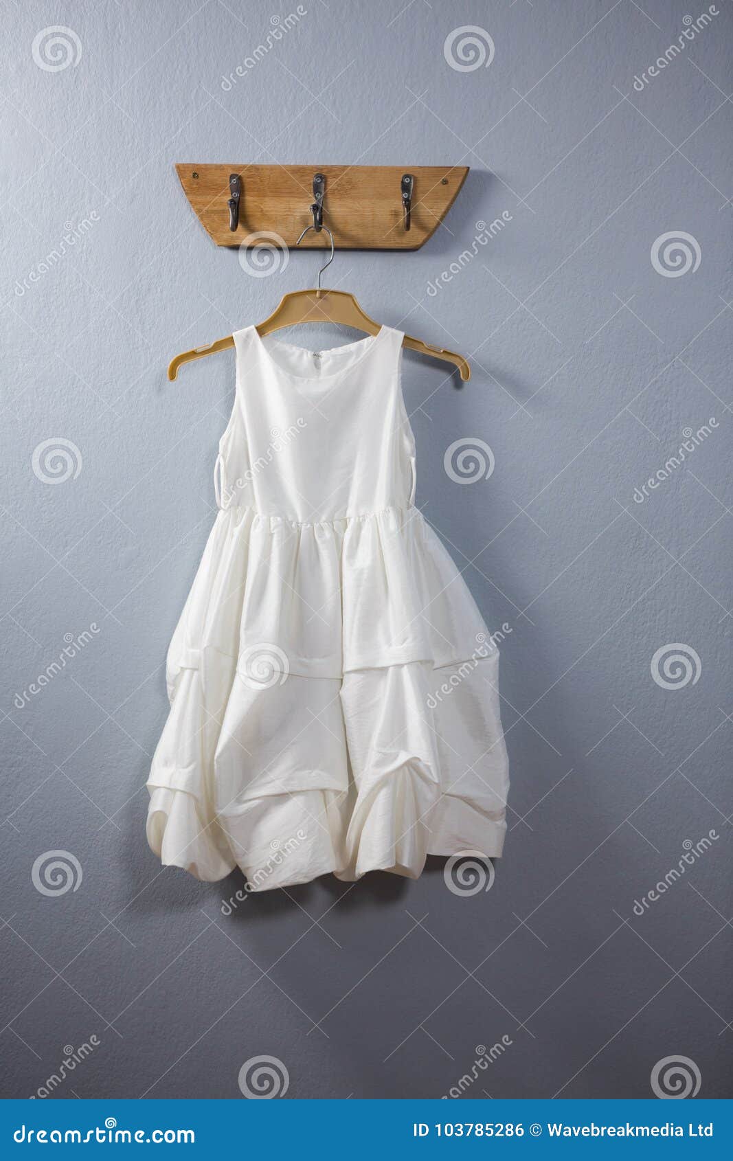 Dress hanging on hook stock photo. Image of elegance - 103785286