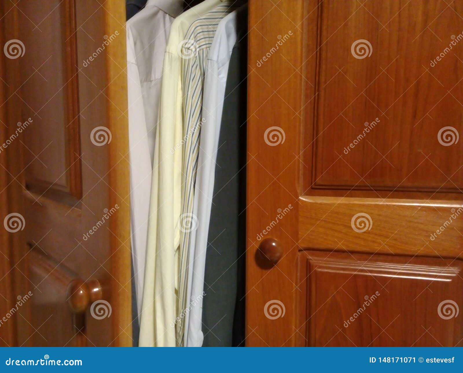 dress shirts in the wooden closet with good light