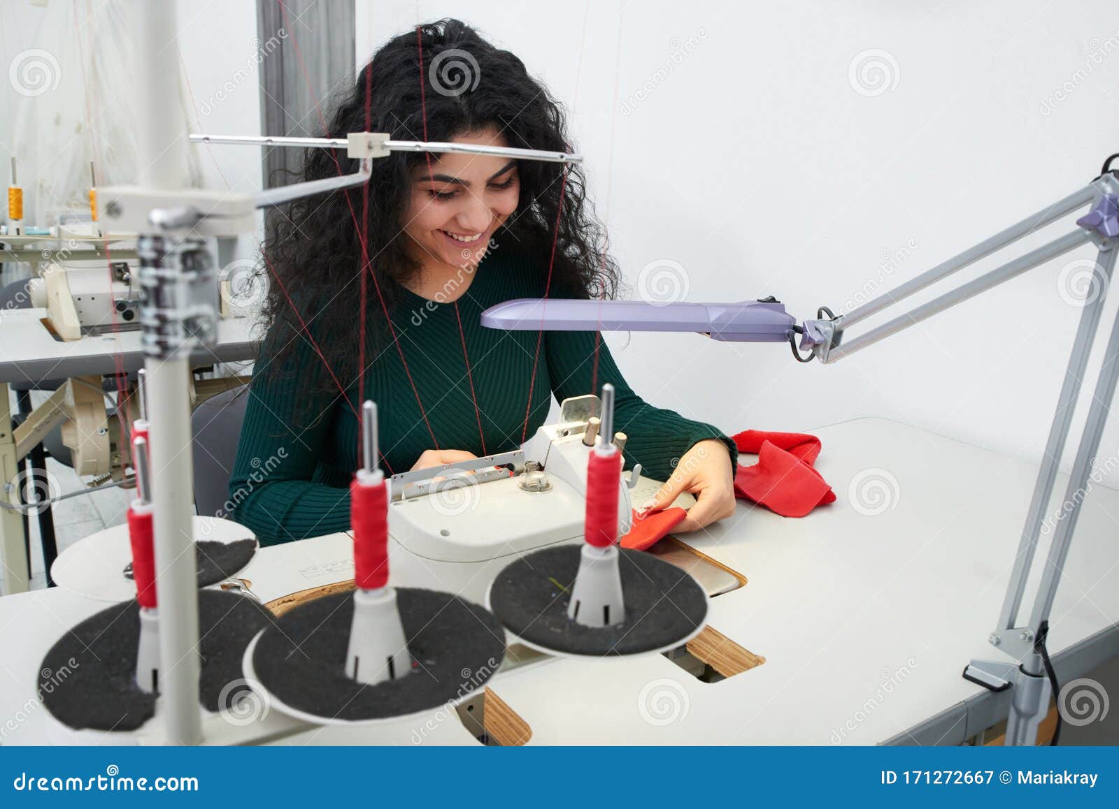 Dressmaker Using Professional Overlock Sewing Machine in