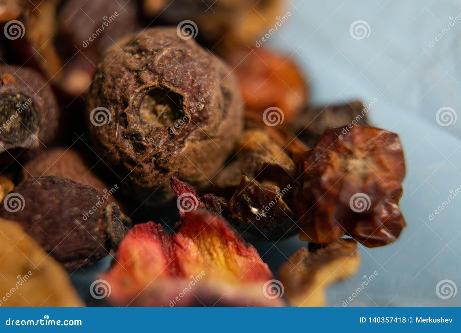 Dried Berries Tea Mixture of Berries, Closeup on Blue Background