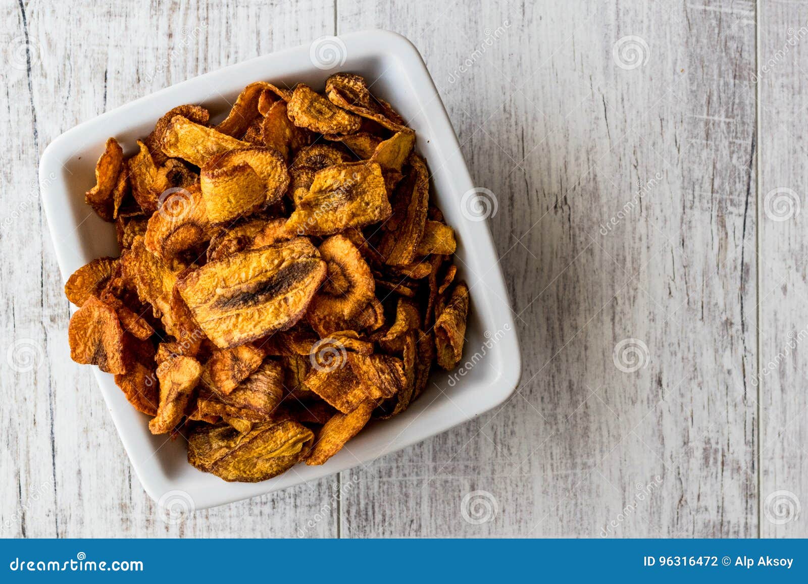 Dried Carrot Chips on White Wooden Surface. Stock Photo Image of