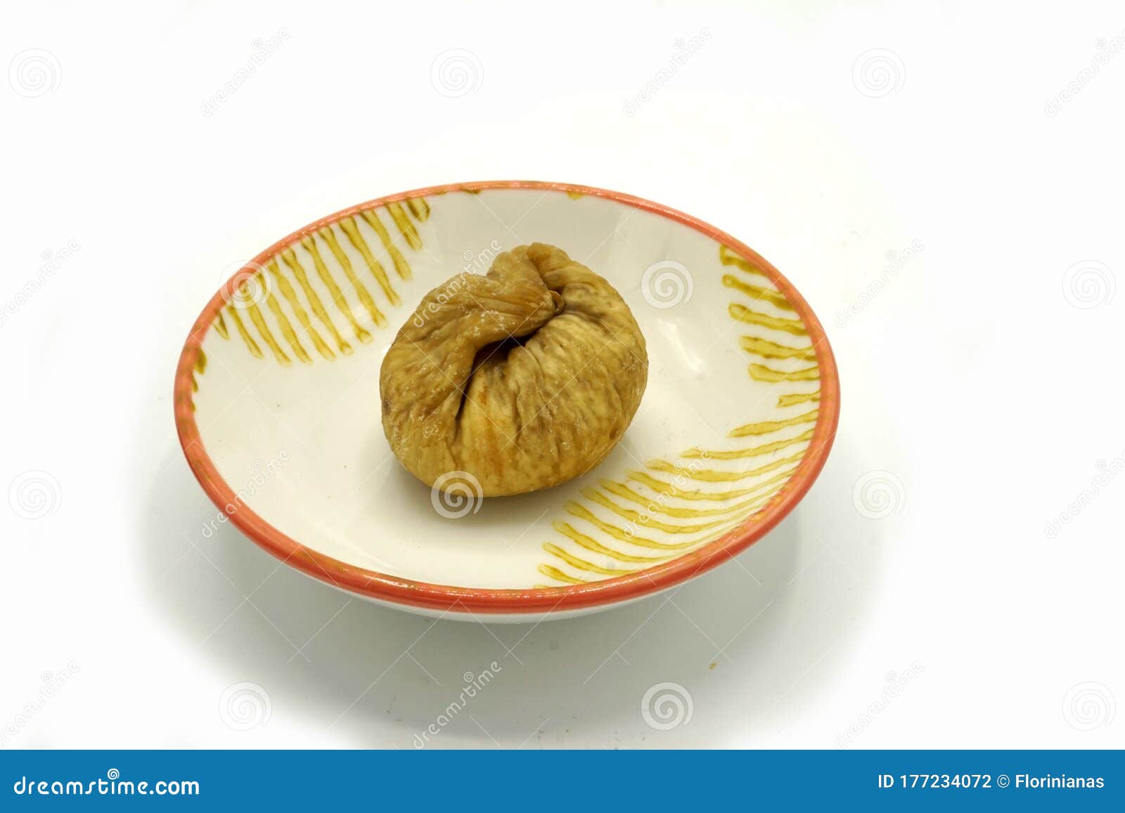 dried figs on a ceramic saucer  on white background. energy and fiber natural source. dieting food
