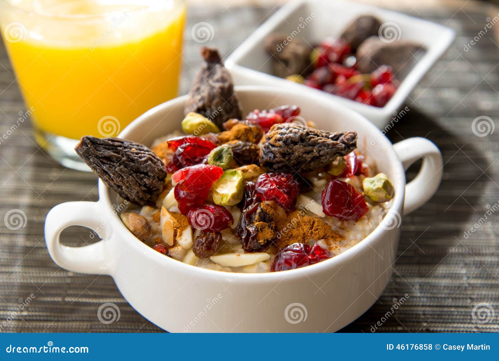 Dried Figs, Oatmeal and Orange Juice Breakfast Setting Stock Photo