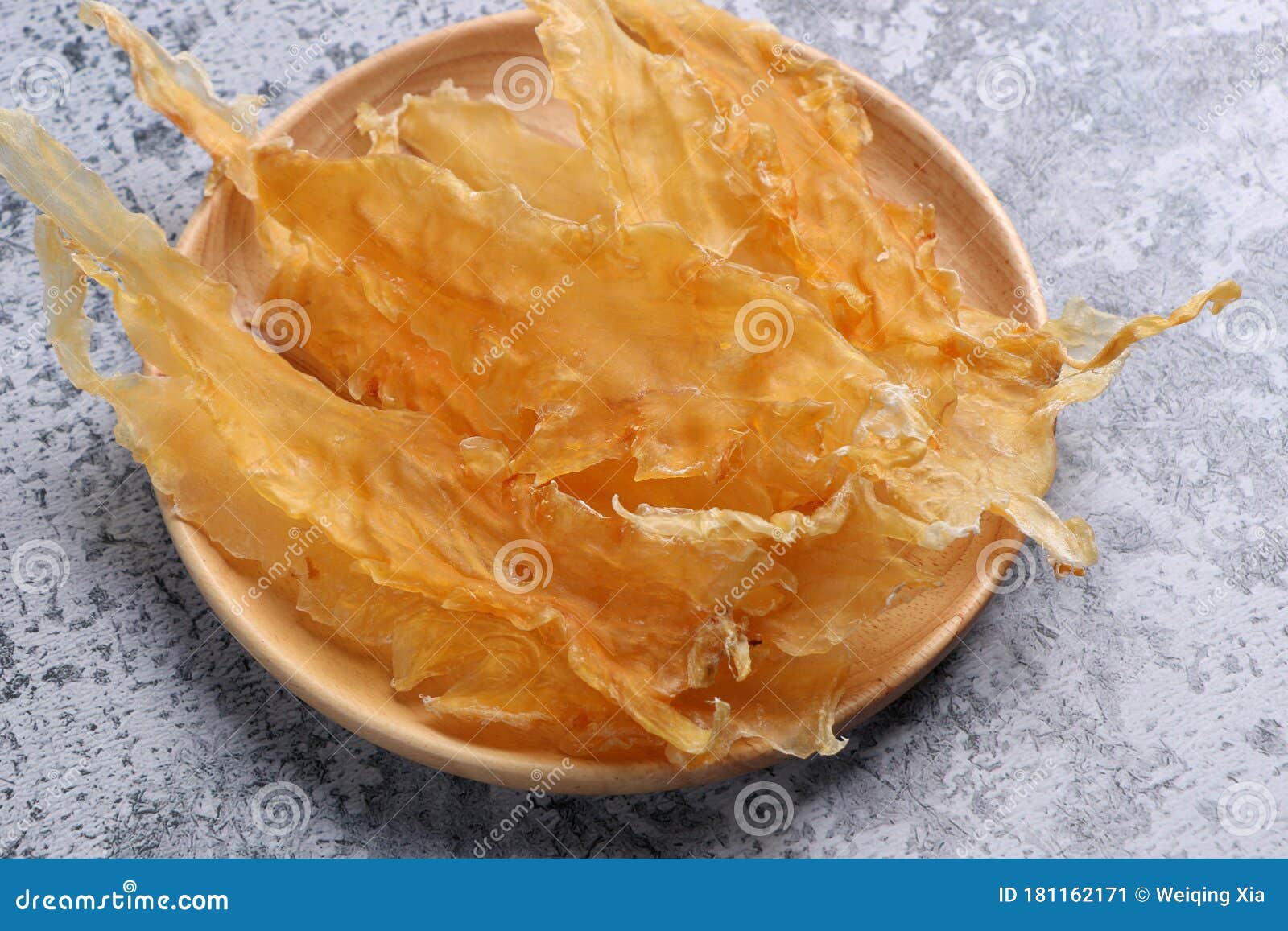 dried fish maw on wooden table.