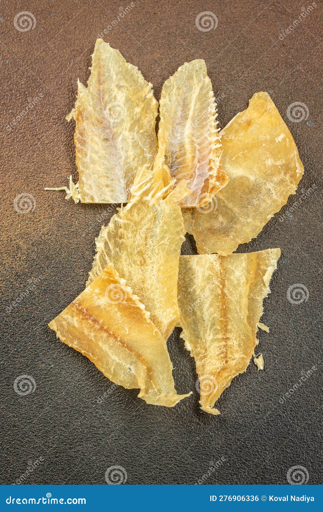 Dried Fish Snack on a Dark Background. Place for Text, Top View Stock