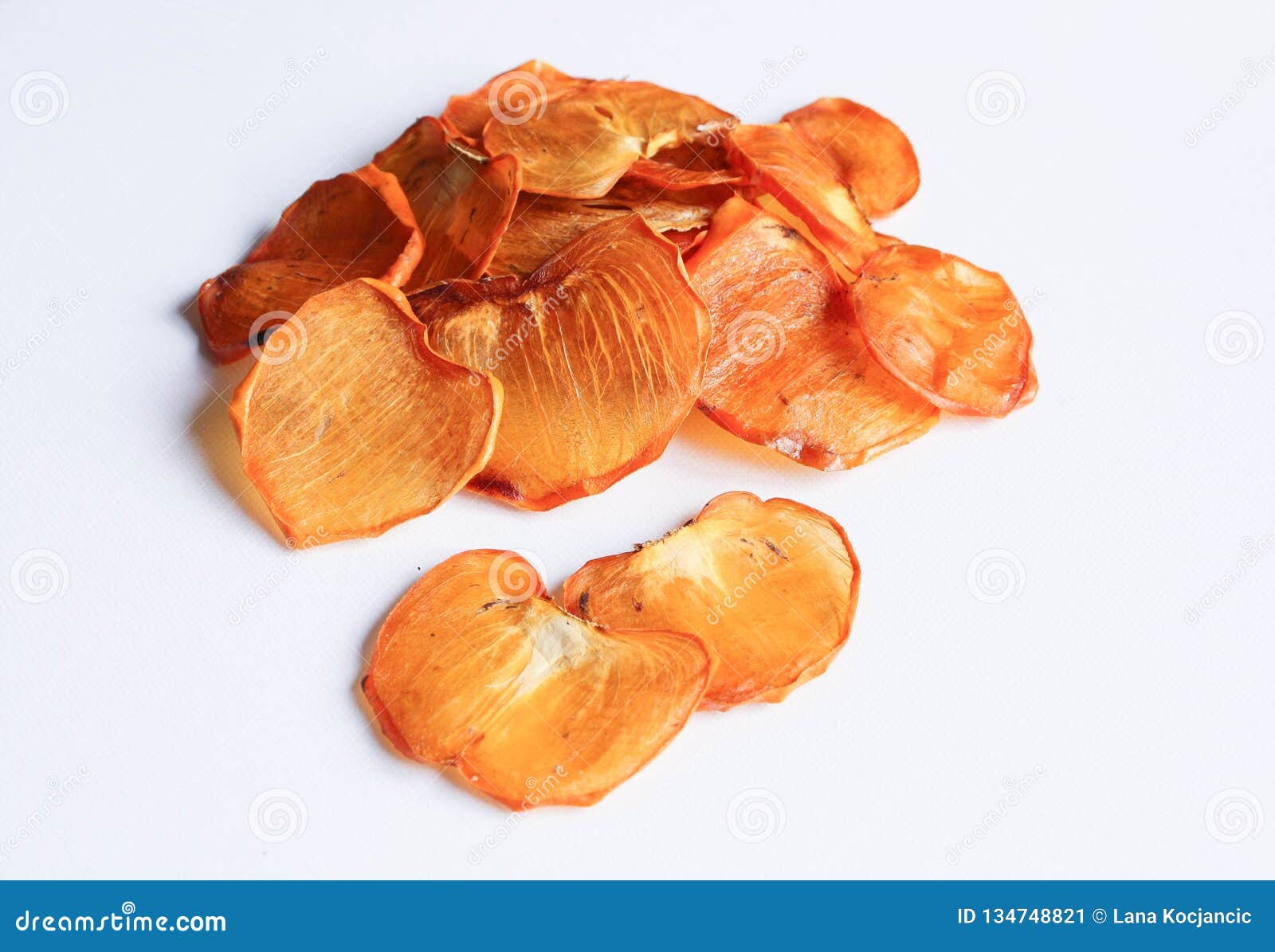 dried persimmon or kaki fruit slices  on white