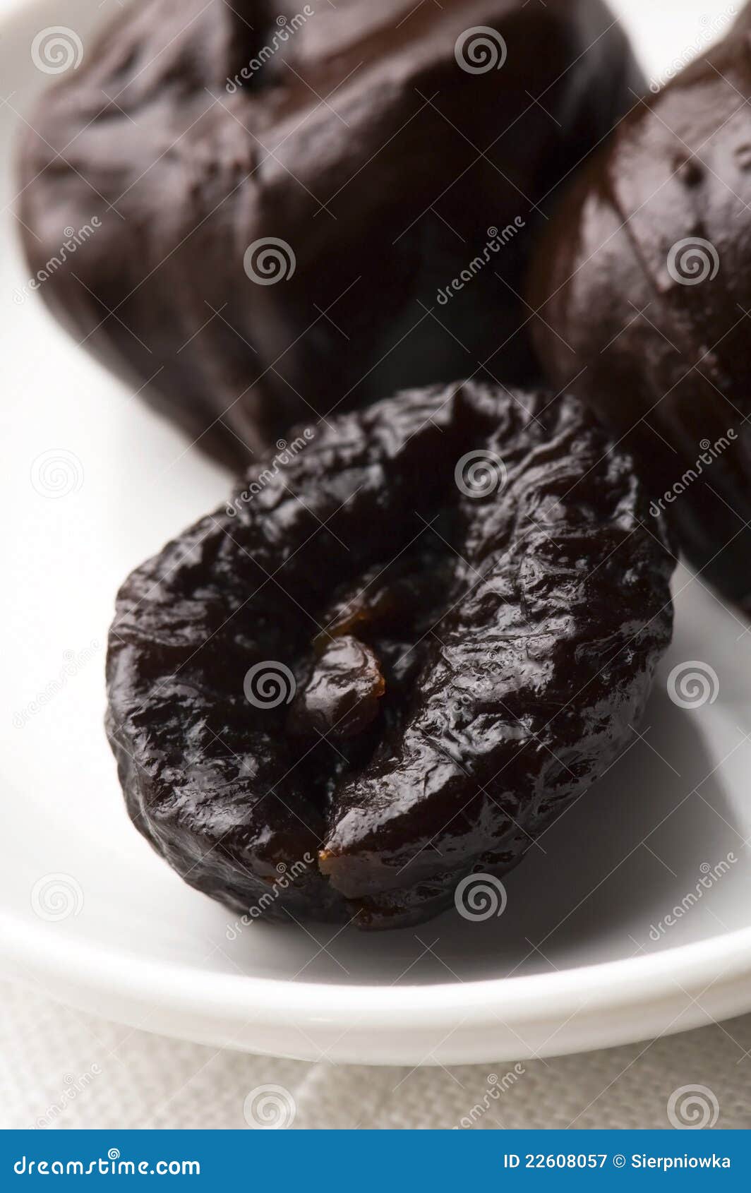 Dried plums in chocolate stock image. Image of dried 22608057