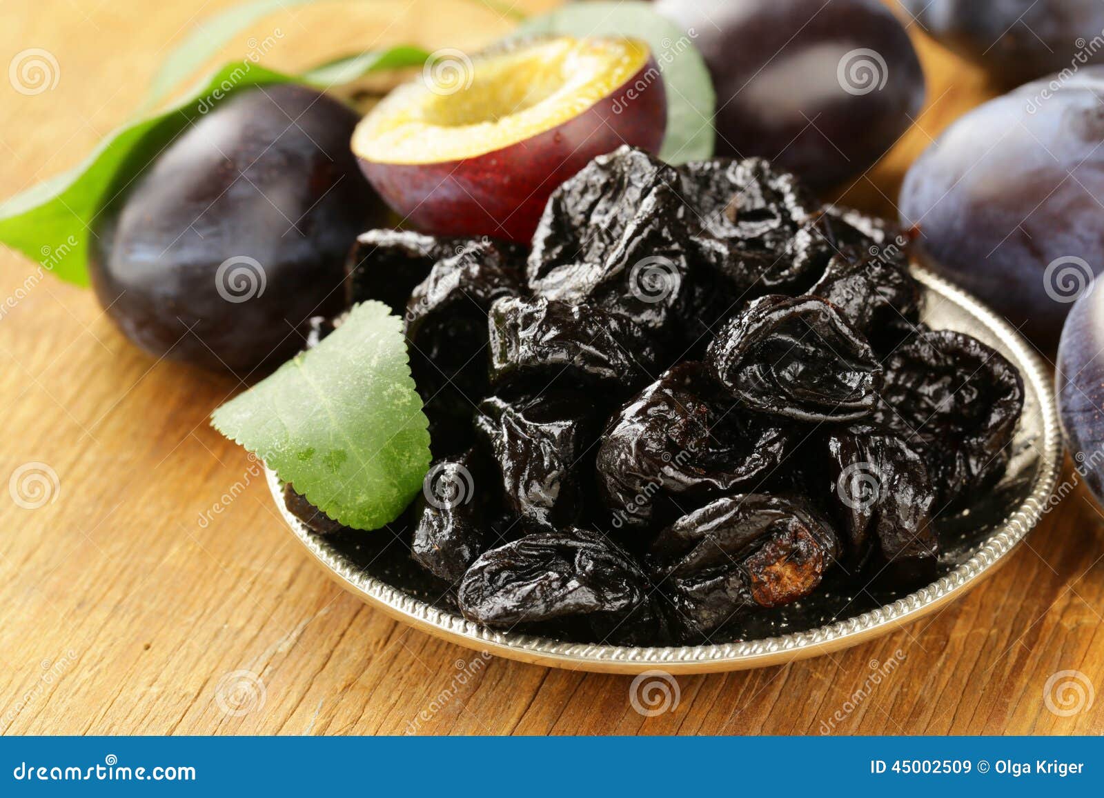dried plums prunes and fresh berries