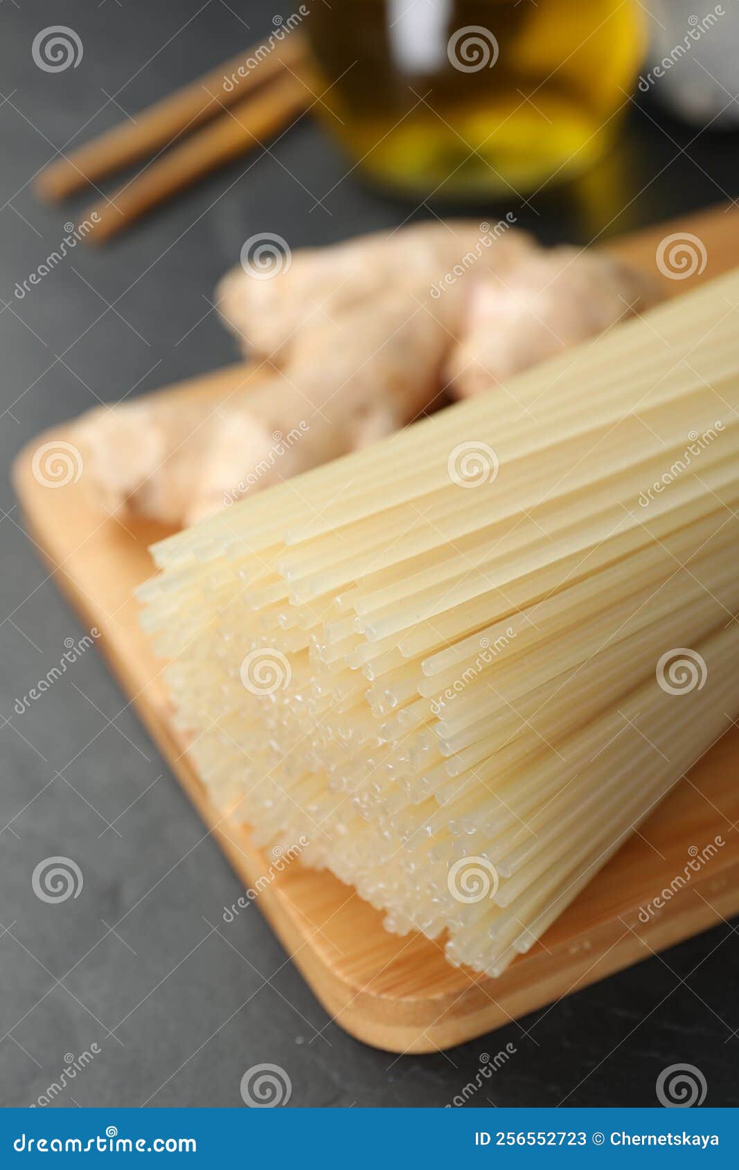 Dried Rice Noodles with Ginger on Black Table, Closeup Stock Image