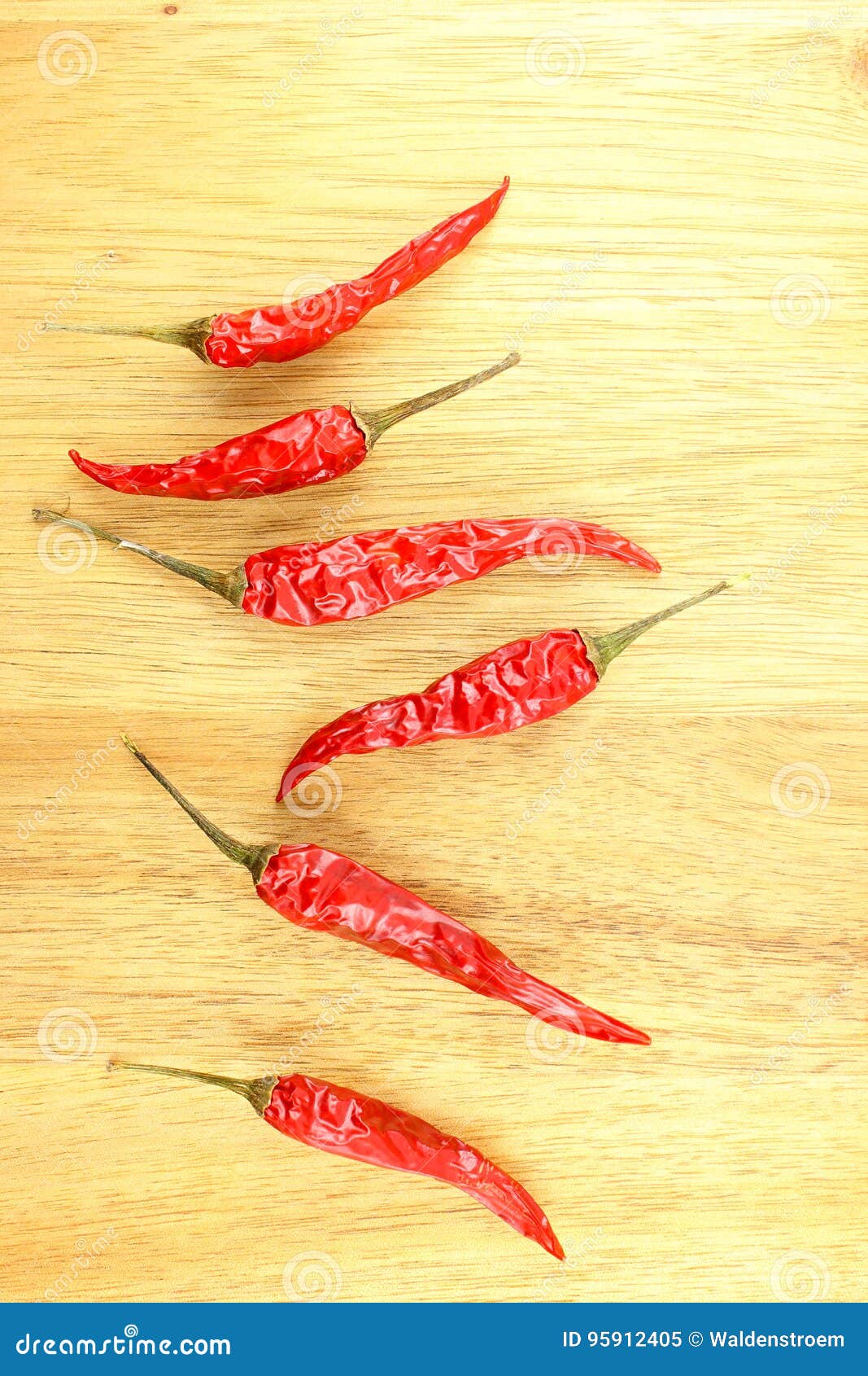 Dried Thai Chili Peppers on a Wooden Board with Copyspace Stock Image