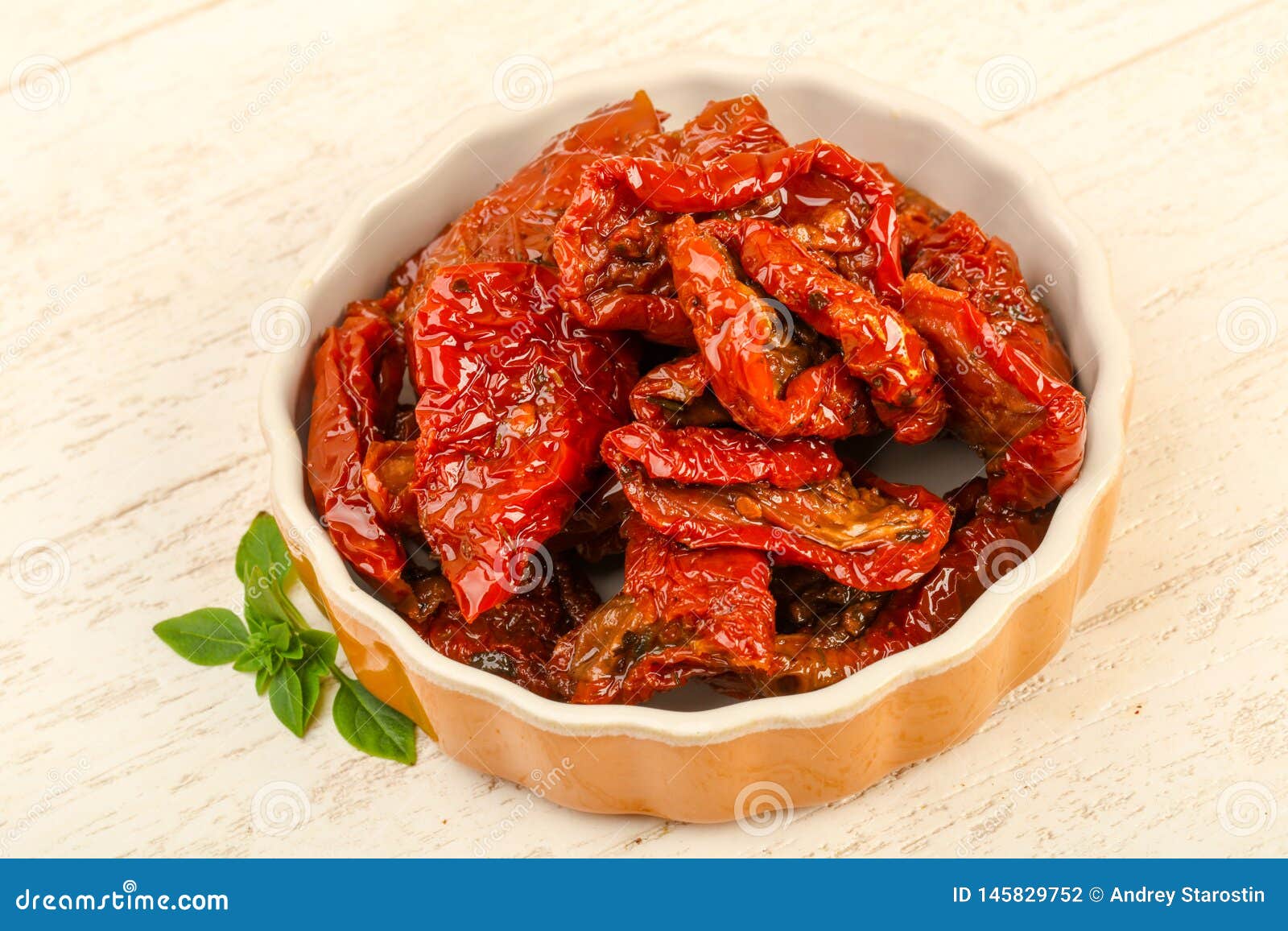 Dried tomato in olive oil stock photo. Image of wooden 145829752