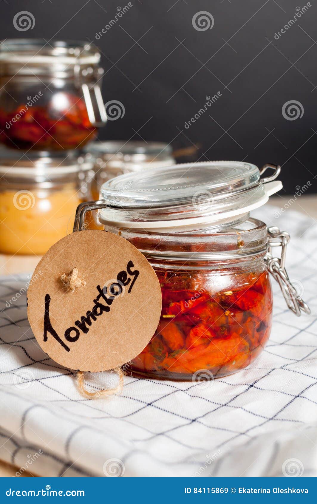 Dried tomatoes in a jar stock image. Image of gourmet 84115869