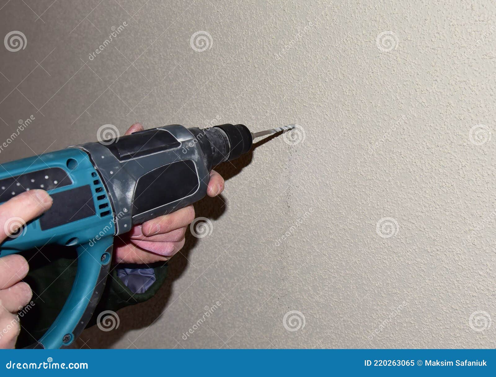 A Drill with a Drill Drills a Hole in a Concrete Wall Stock Image