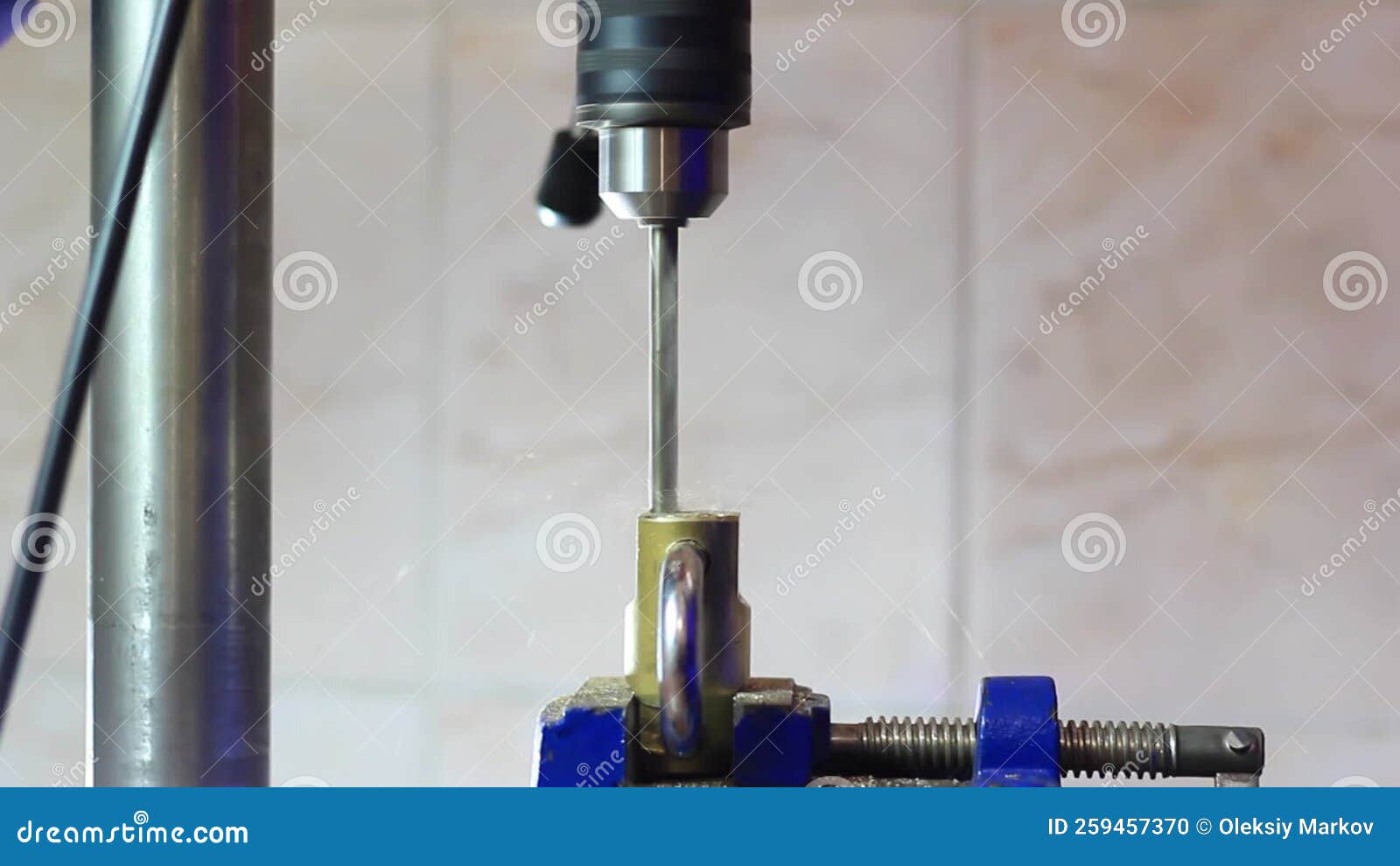 The Drill Drills a Hole in a Metal Lock that is Clamped with a Vise Stock Footage Video of