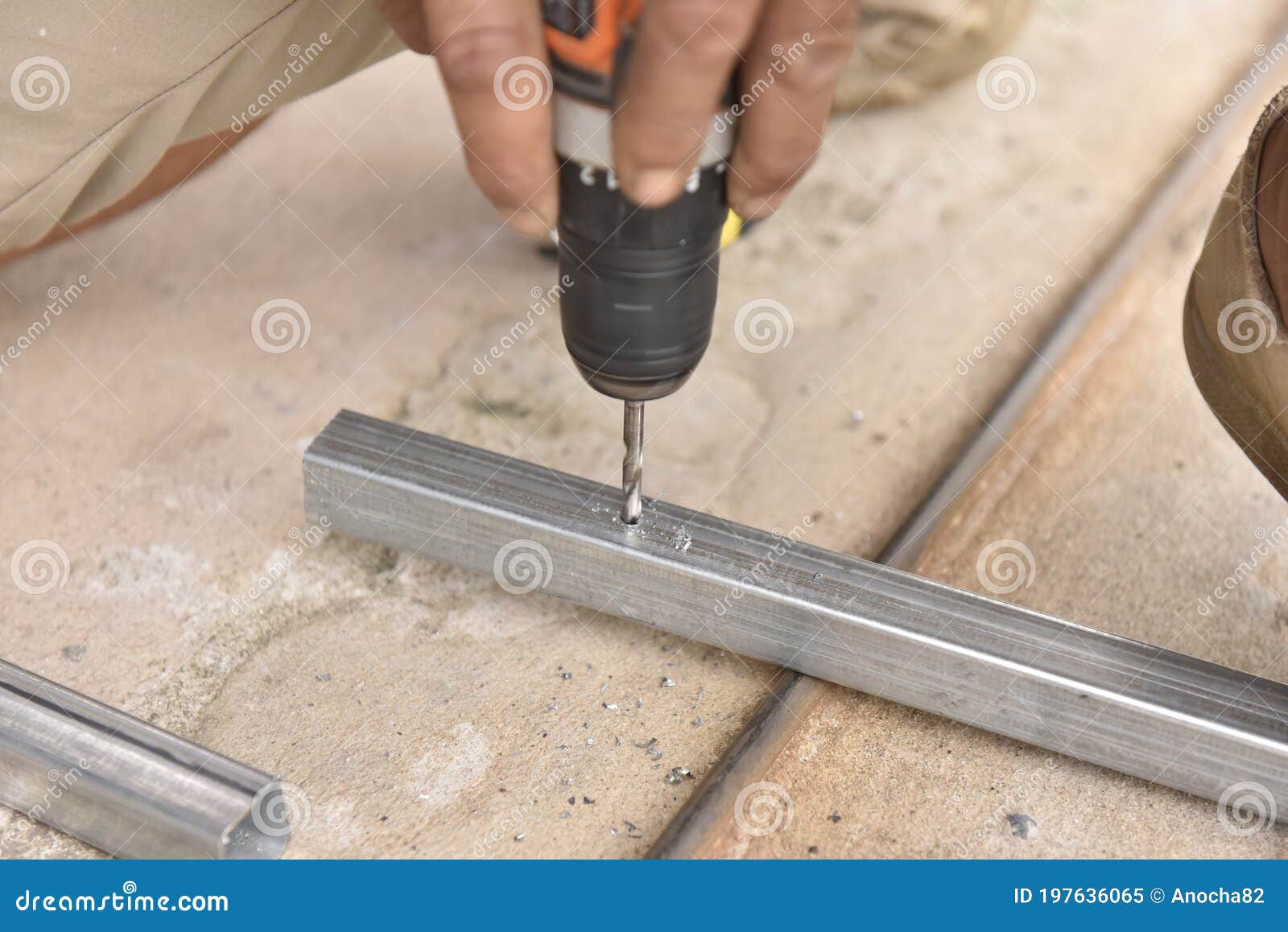 Drill Steel Pipe Using by Hand Drill in Metal Stock Image