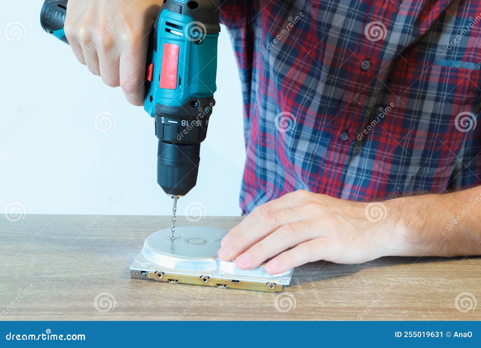 Drilling a Hard Disk Drive To Destroy Evidence Data Close Up.Cropped