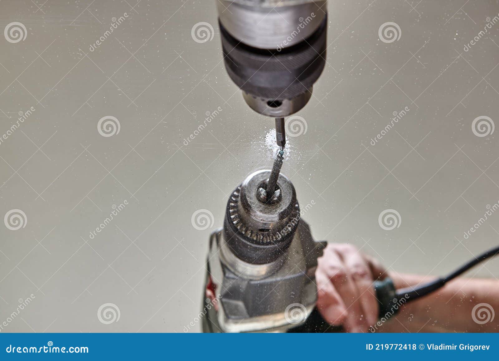 Drilling Hole in Glass or Mirror with Special Drill Bit. Stock Photo