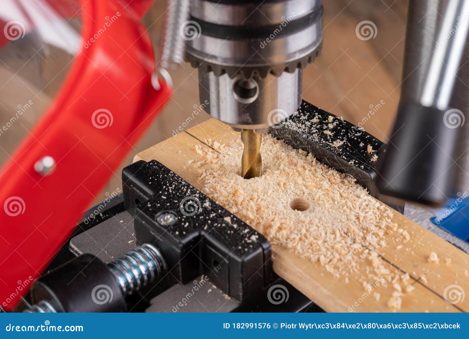 Drilling in Wood with Professional Tools. Work on a Bench Drill Stock