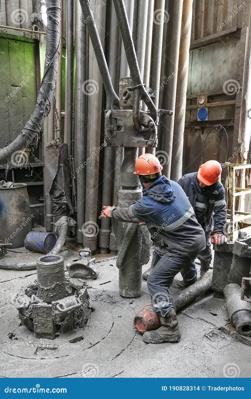 Drilling Workers are Busy Working with the Casing. Editorial Stock