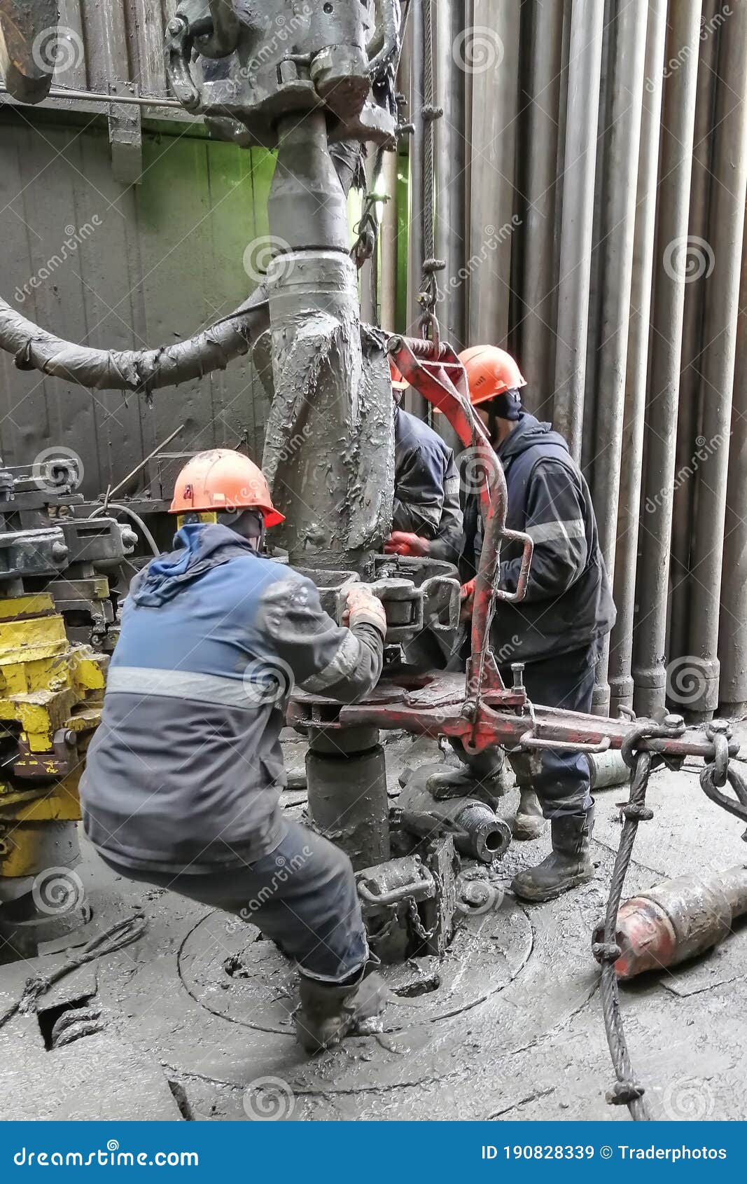 Drilling Workers are Busy Working with the Casing. Editorial Stock