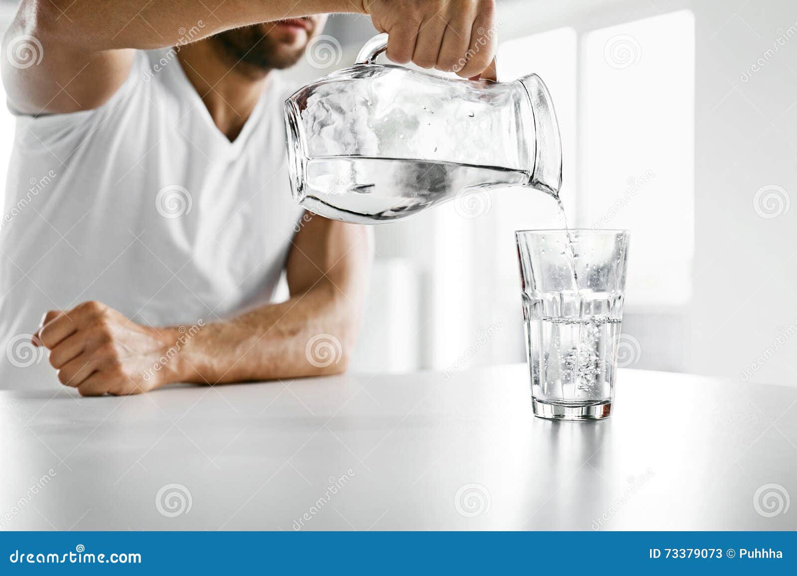 drink water. close up man pouring water into glass. hydration