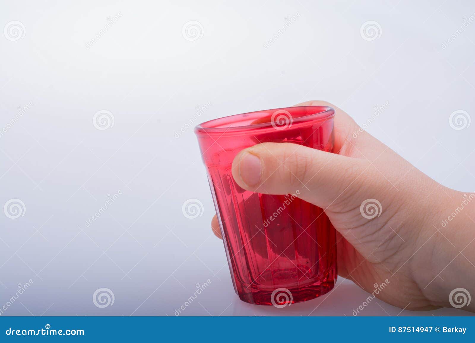 Drinking Glasses of Red Color in Hand Stock Image Image of party