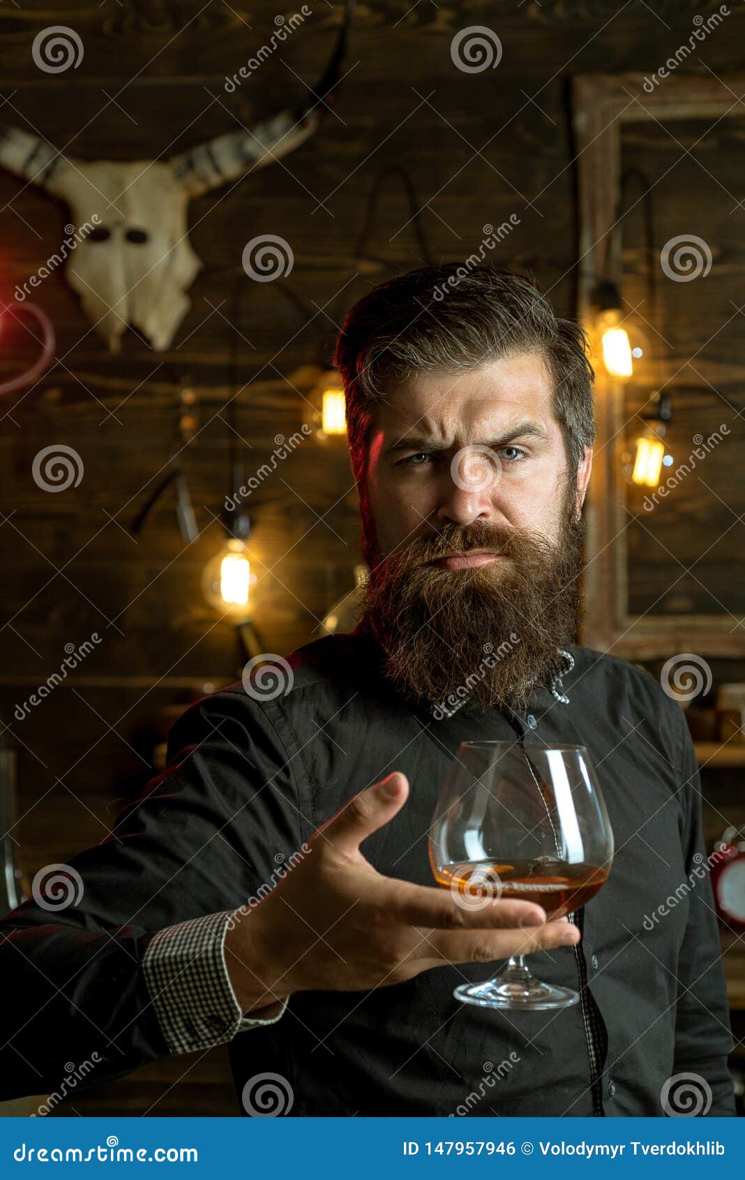 Drinking Man. Retro Bar. Handsome Pensive Man is Holding a Glass of