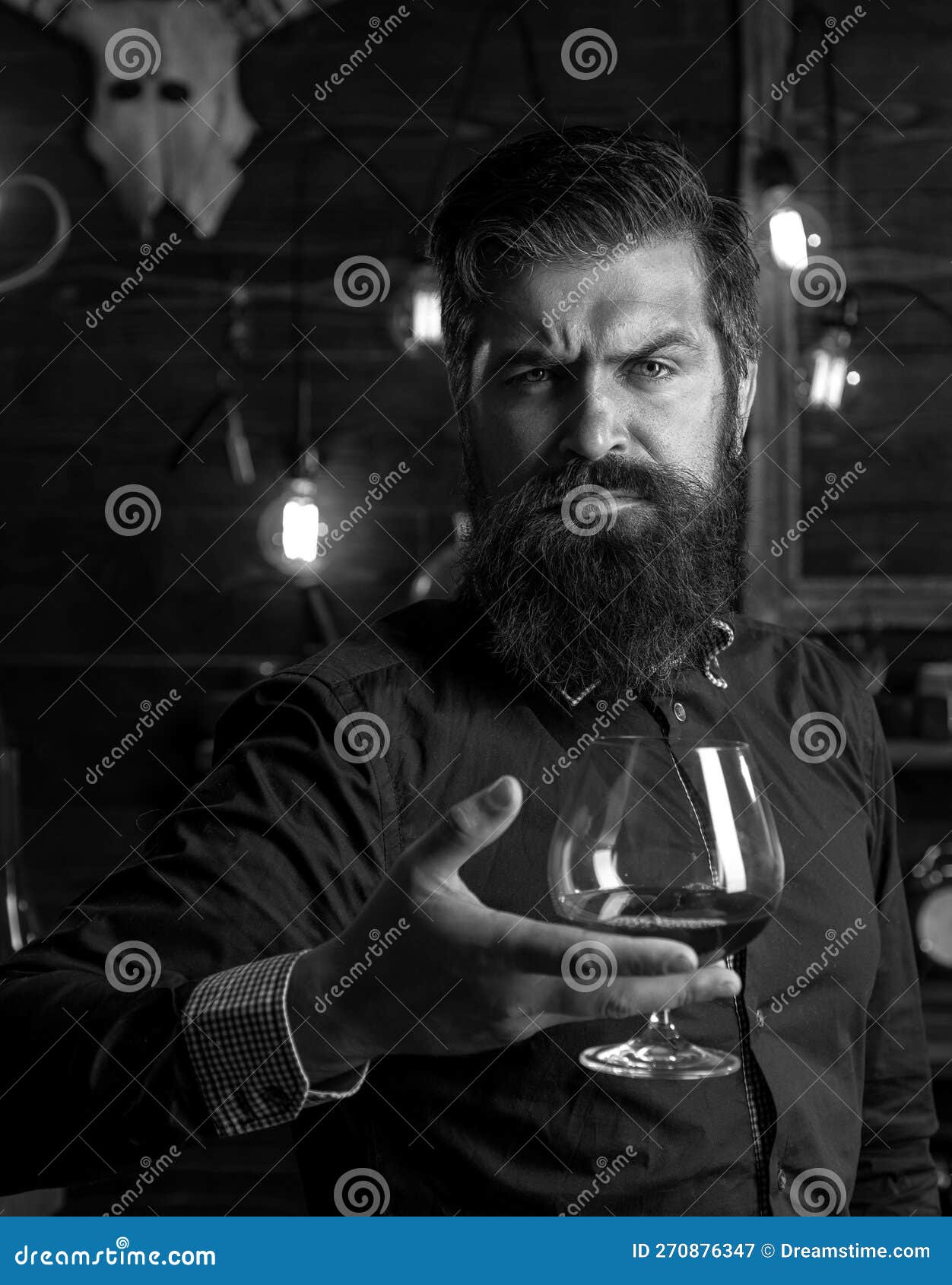 Drinking Man. Retro Bar. Handsome Pensive Man is Holding a Glass of
