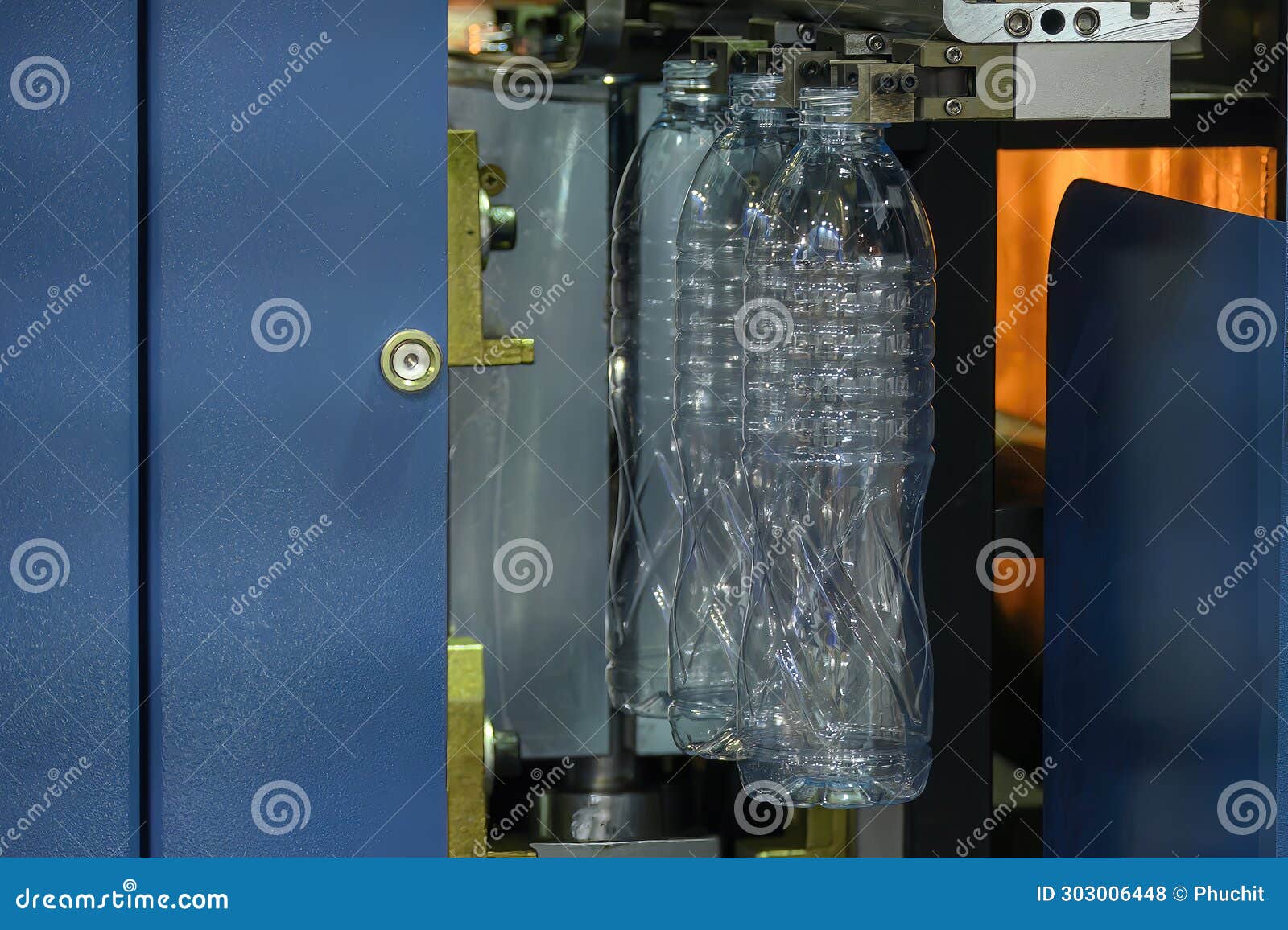 The Drinking Water Bottle Manufacturing Process by Blow Mold Machine Stock Photo Image of