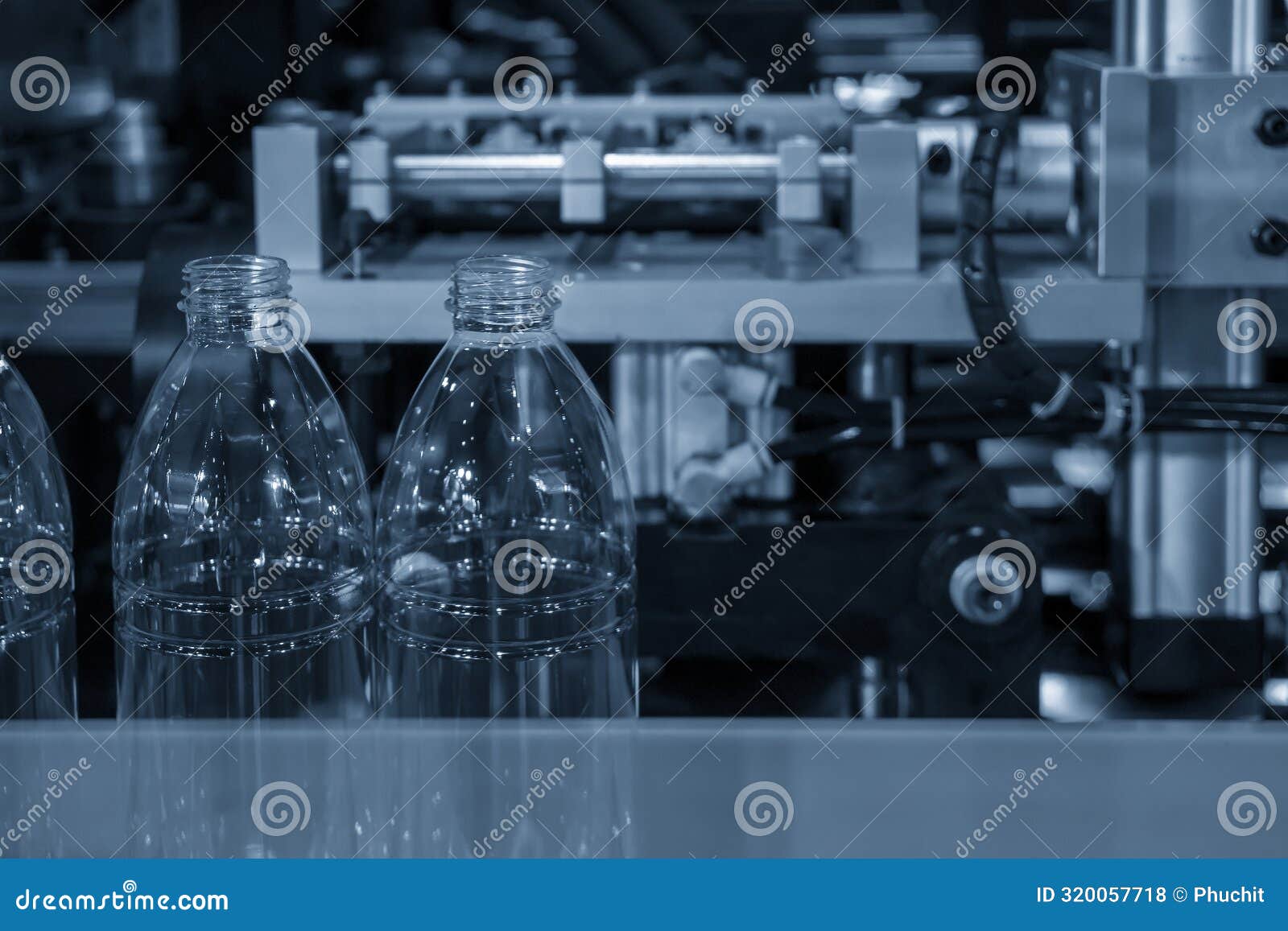The Drinking Water Bottle Manufacturing Process by Blow Mold Machine Stock Photo Image of heat