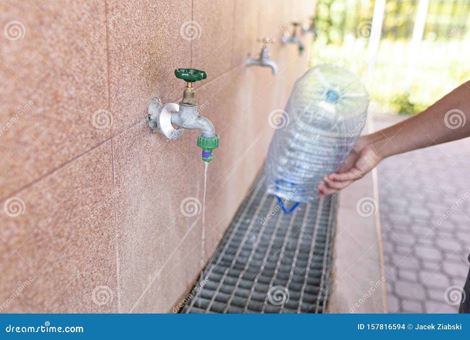 Drinking Water Intake. Pouring Water into a Plastic Bottle Stock Photo