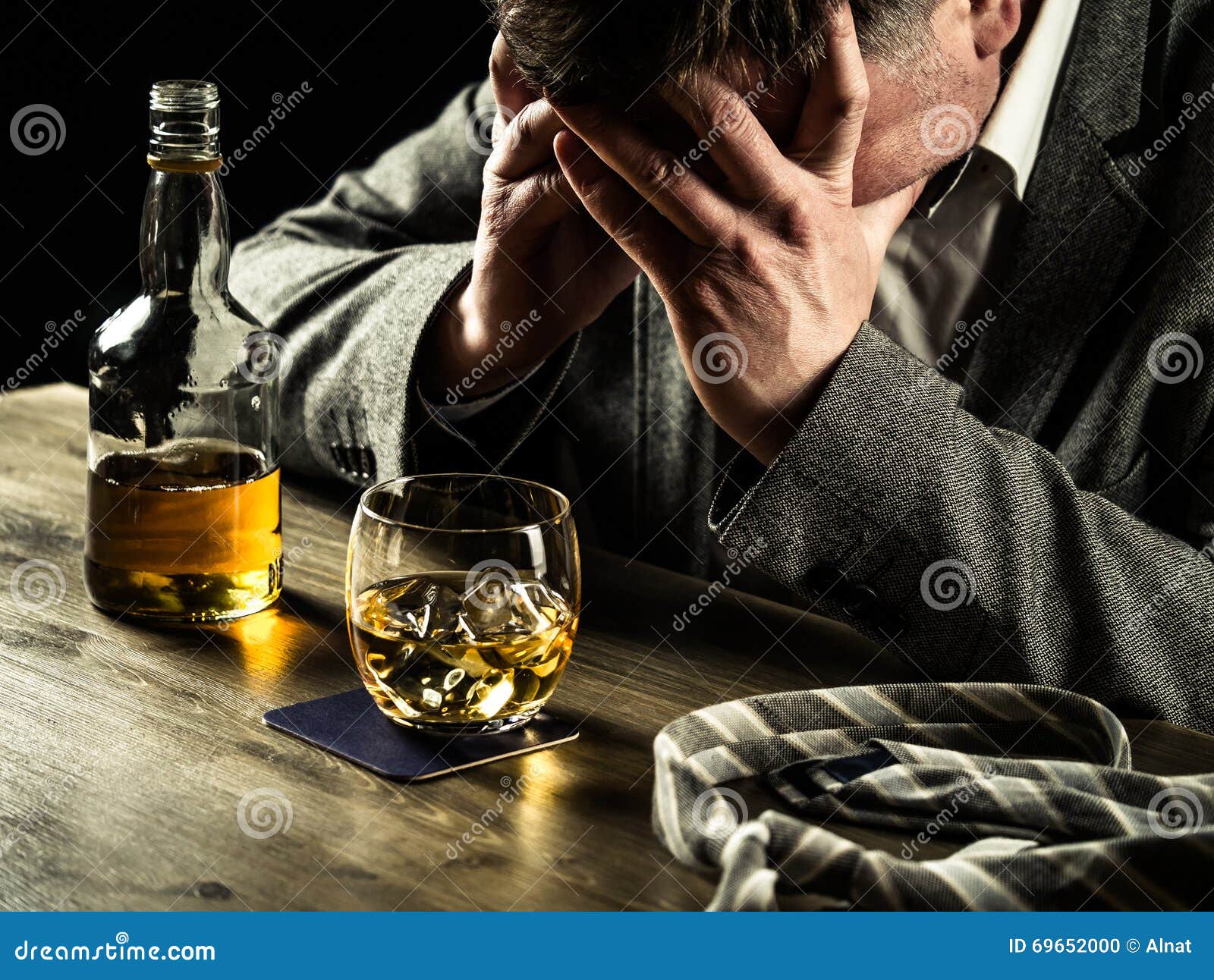 Drinking whiskey at night stock photo. Image of jacket 69652000
