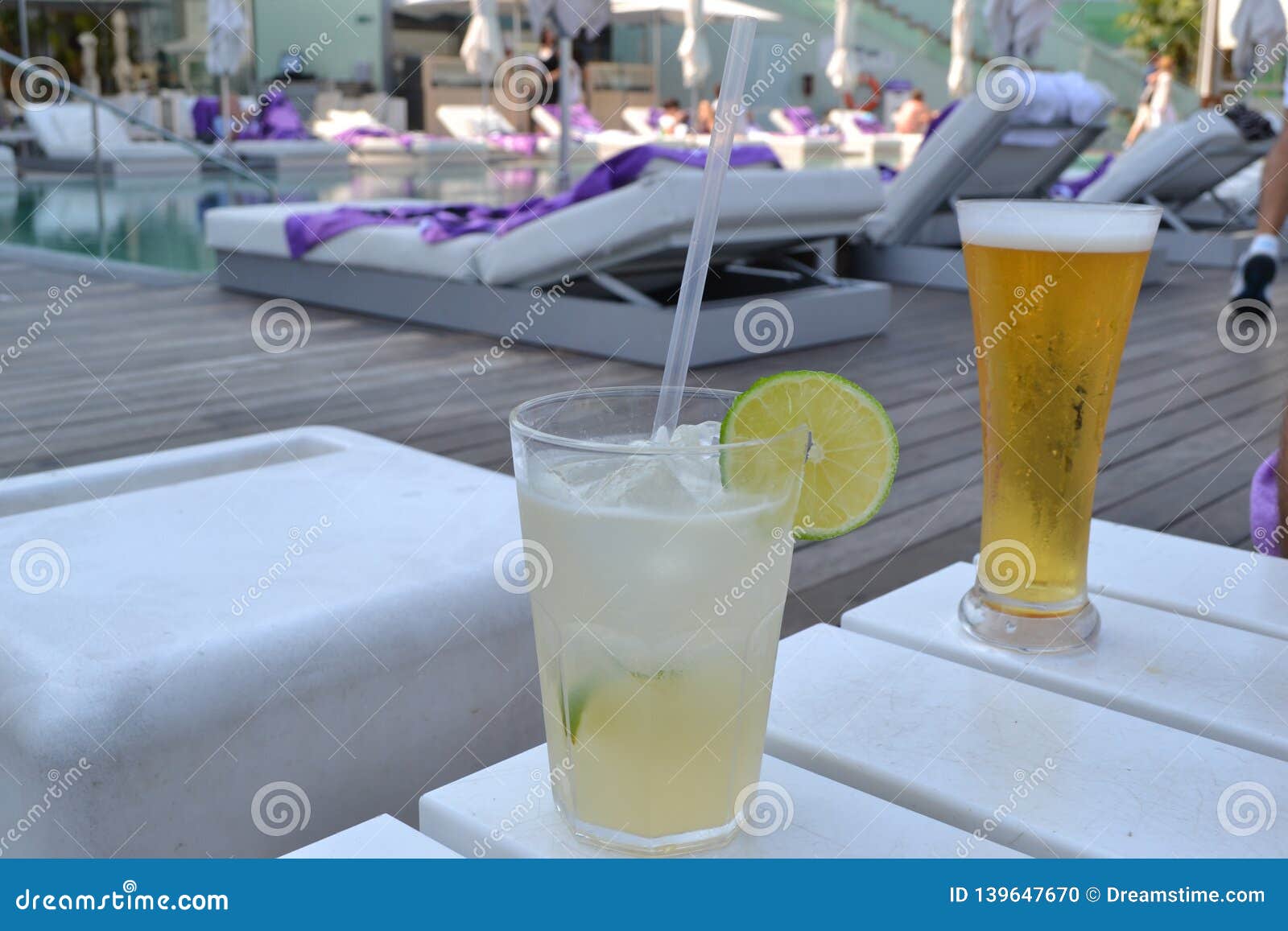 drinks on mediterranean beach la playa de la barceloneta - barcelona spain