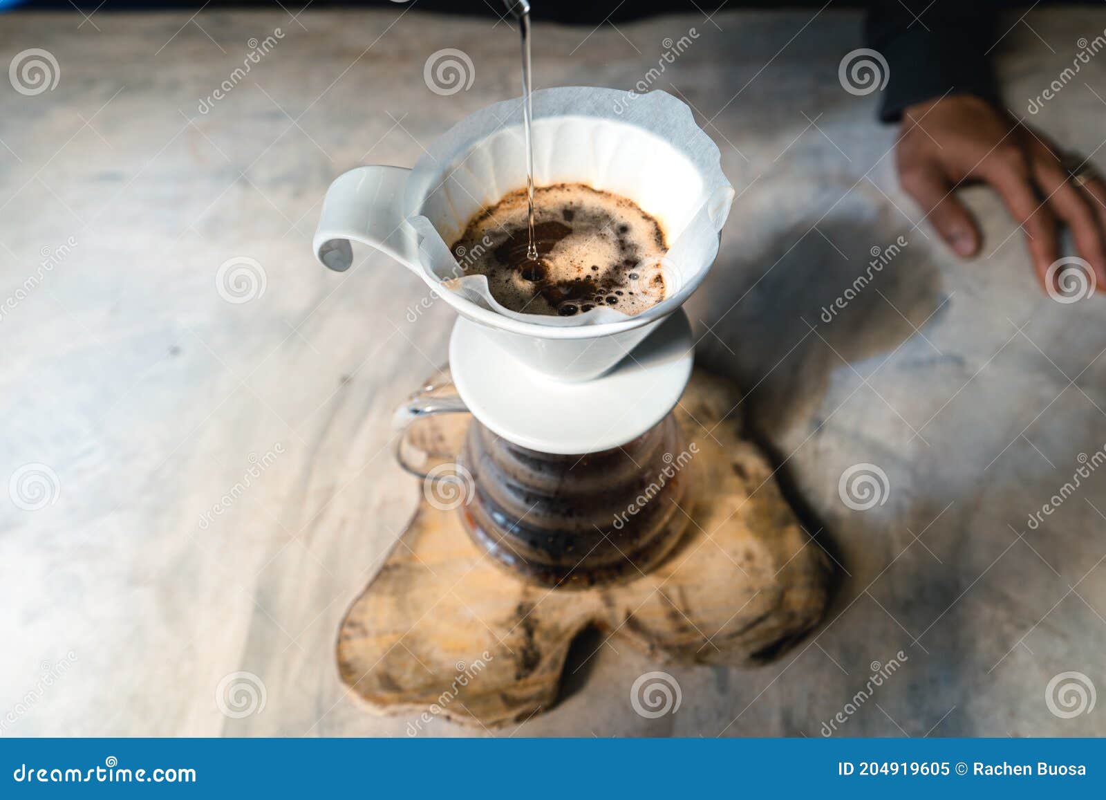 Drip Coffee, Barista Pouring Water on Coffee Ground with Filter Stock