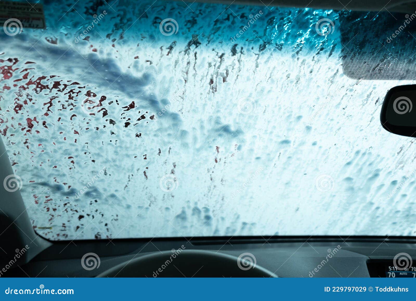 Drive through Car Wash from Inside an Automobile Being Washed Stock