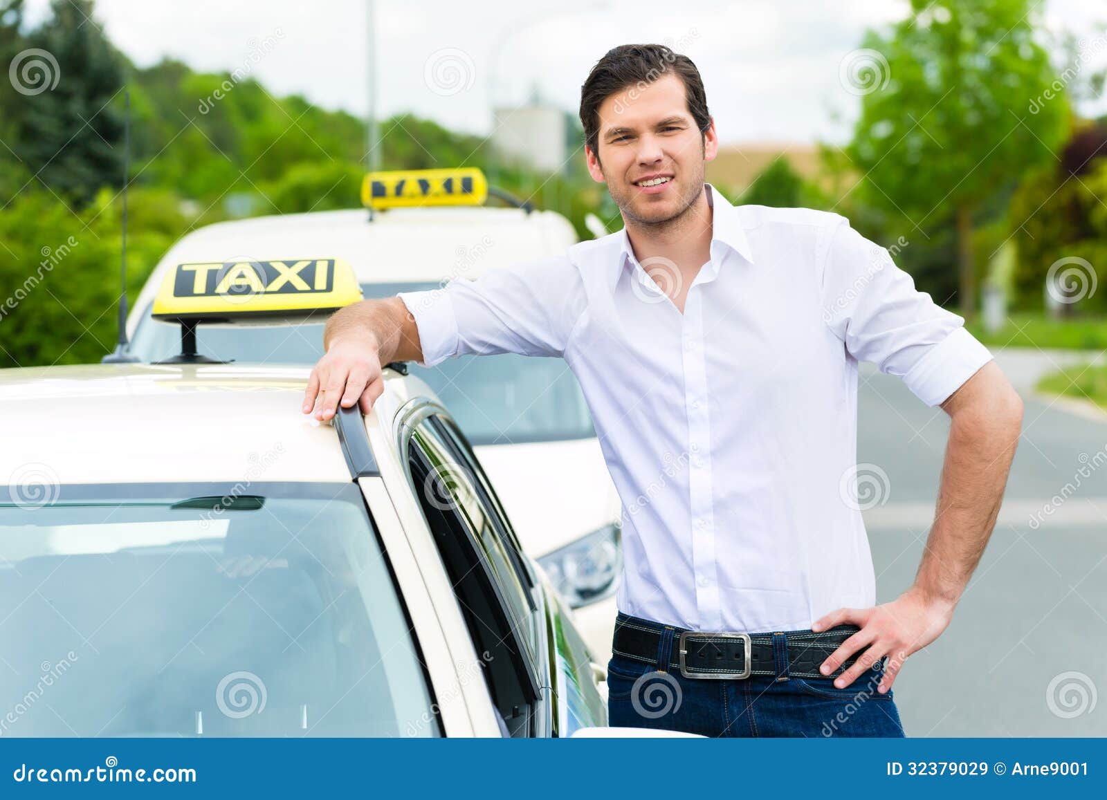 driver in front of taxi waiting for clients