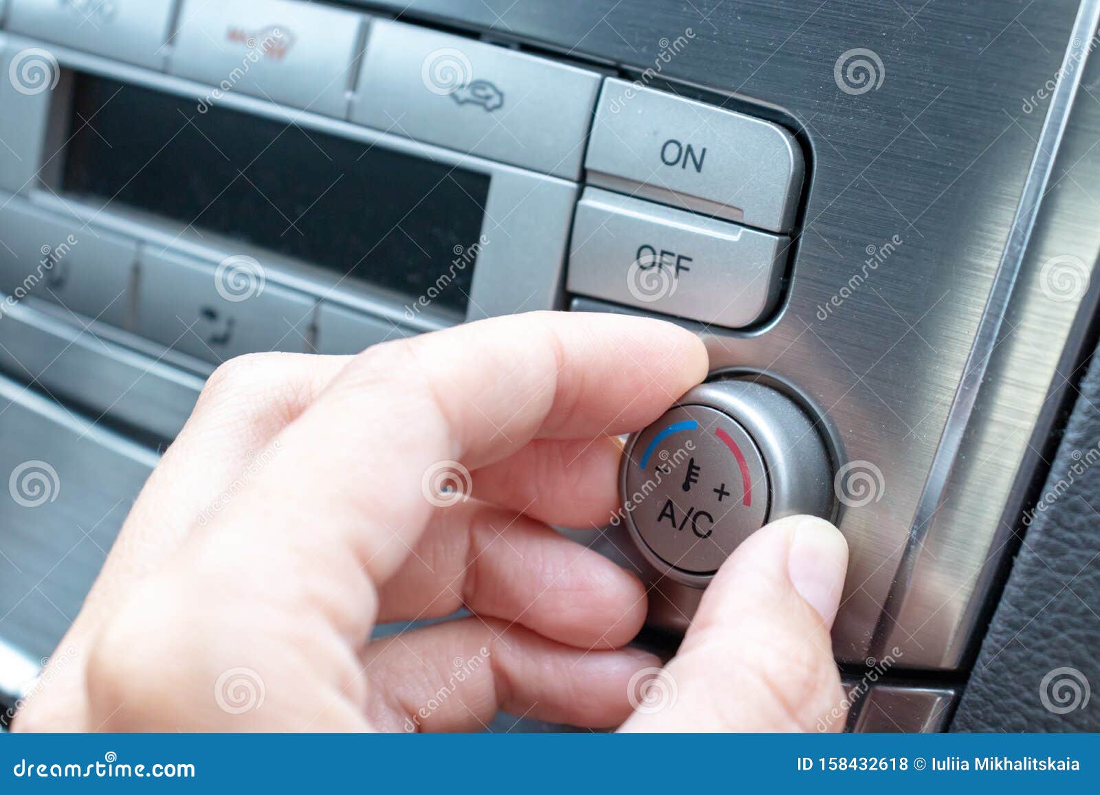 Close Businessman Hand Tuning Air Ventilation Grille While Driving