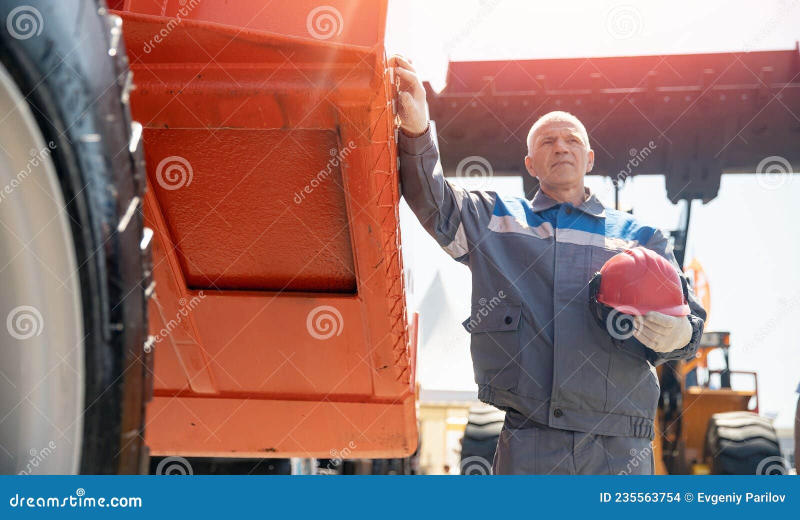 Driver Man of Construction Equipment Excavator or Tractor. Builder or