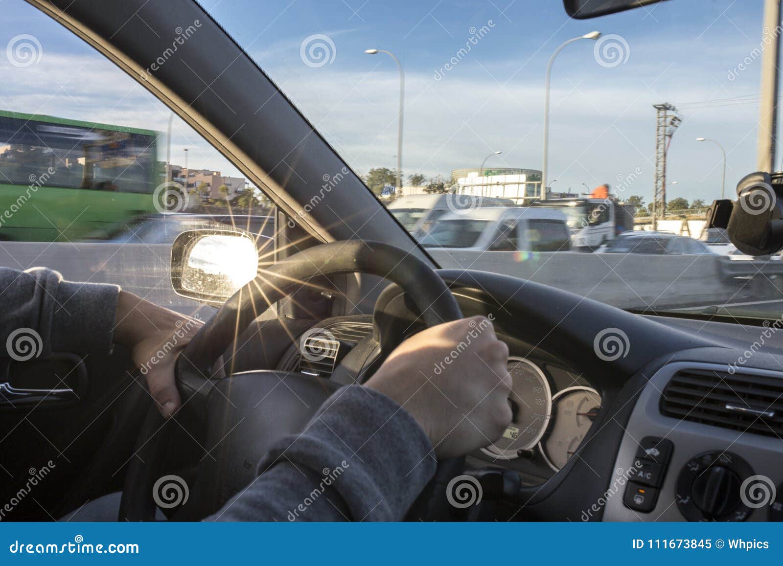 driving with annoying sun reflections from rear view mirror