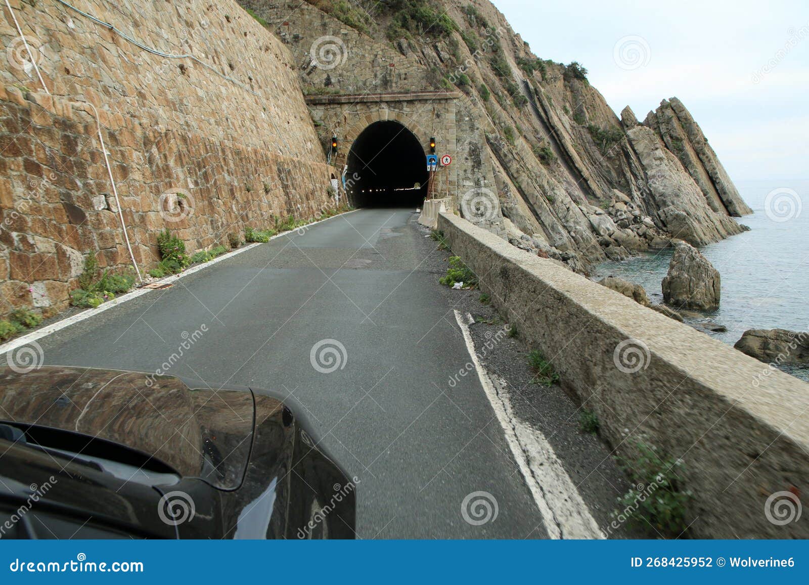 driving the car towards the narrow coastline