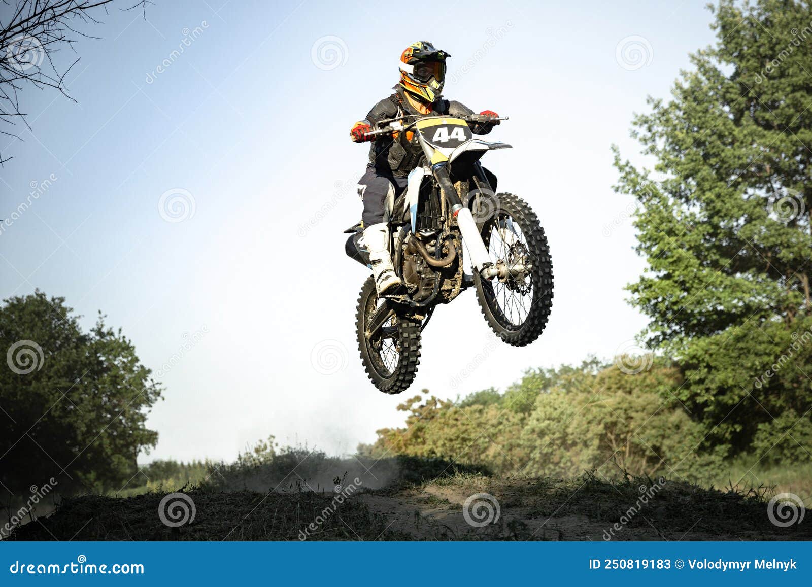 Live Shot of Male Sportsman Training on Motorbike at Hot Summer Day, Outdoors