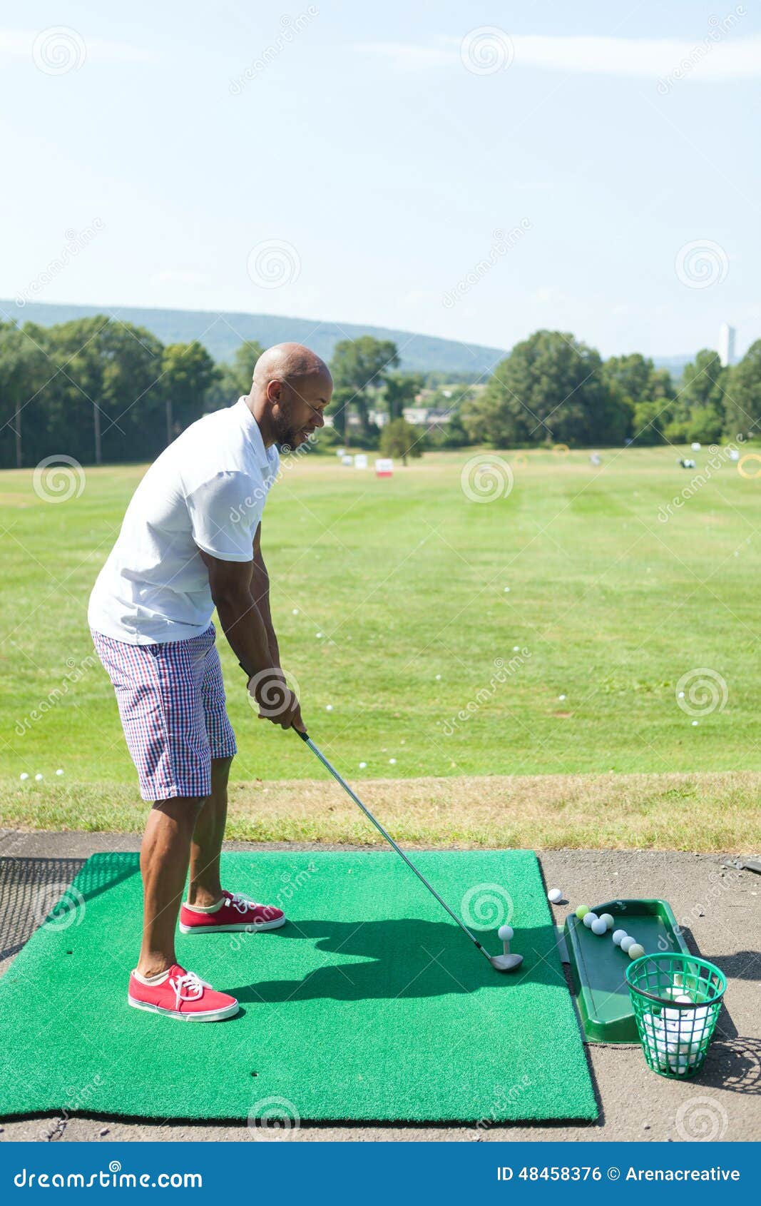 Driving Range Tee Off stock photo. Image of muscular 48458376