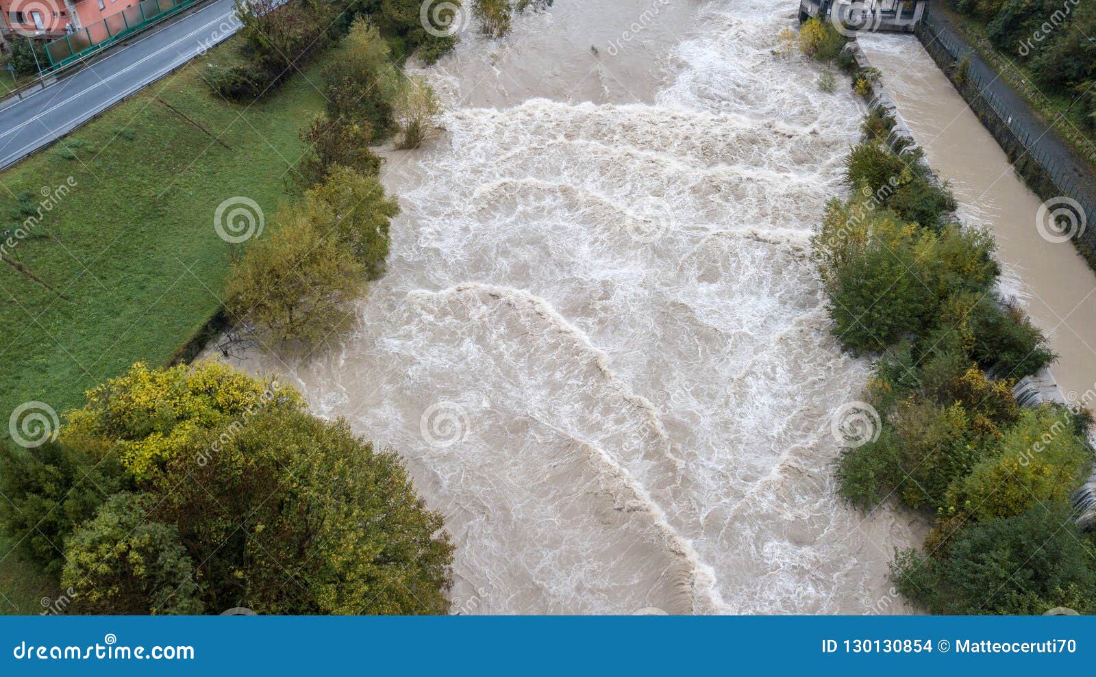 drone aerial view of the serio river swollen after heavy rains. province of bergamo, northern italy