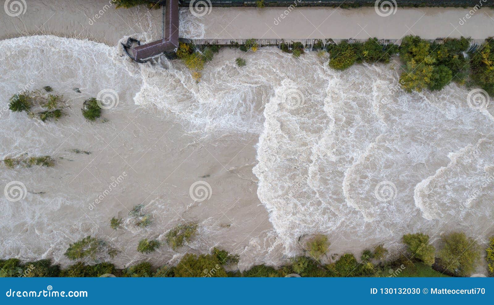 drone aerial view of the serio river swollen after heavy rains. province of bergamo, northern italy