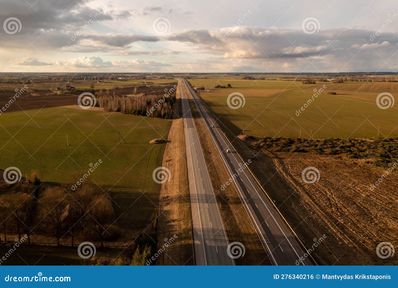 Drone Footage of Highway Surrounded by Agriculture Fields and Forest