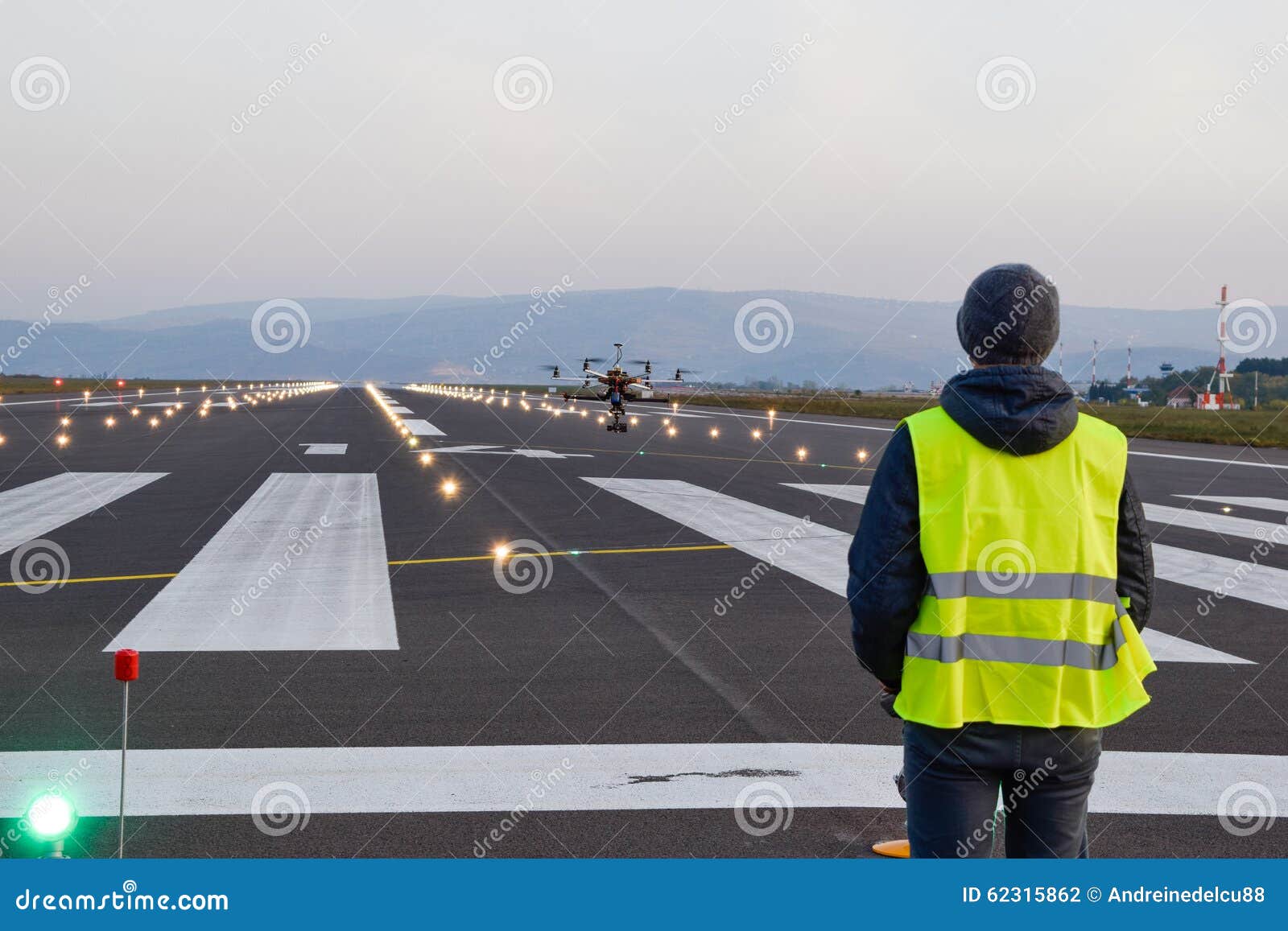 drone inspection over airport runway with operator