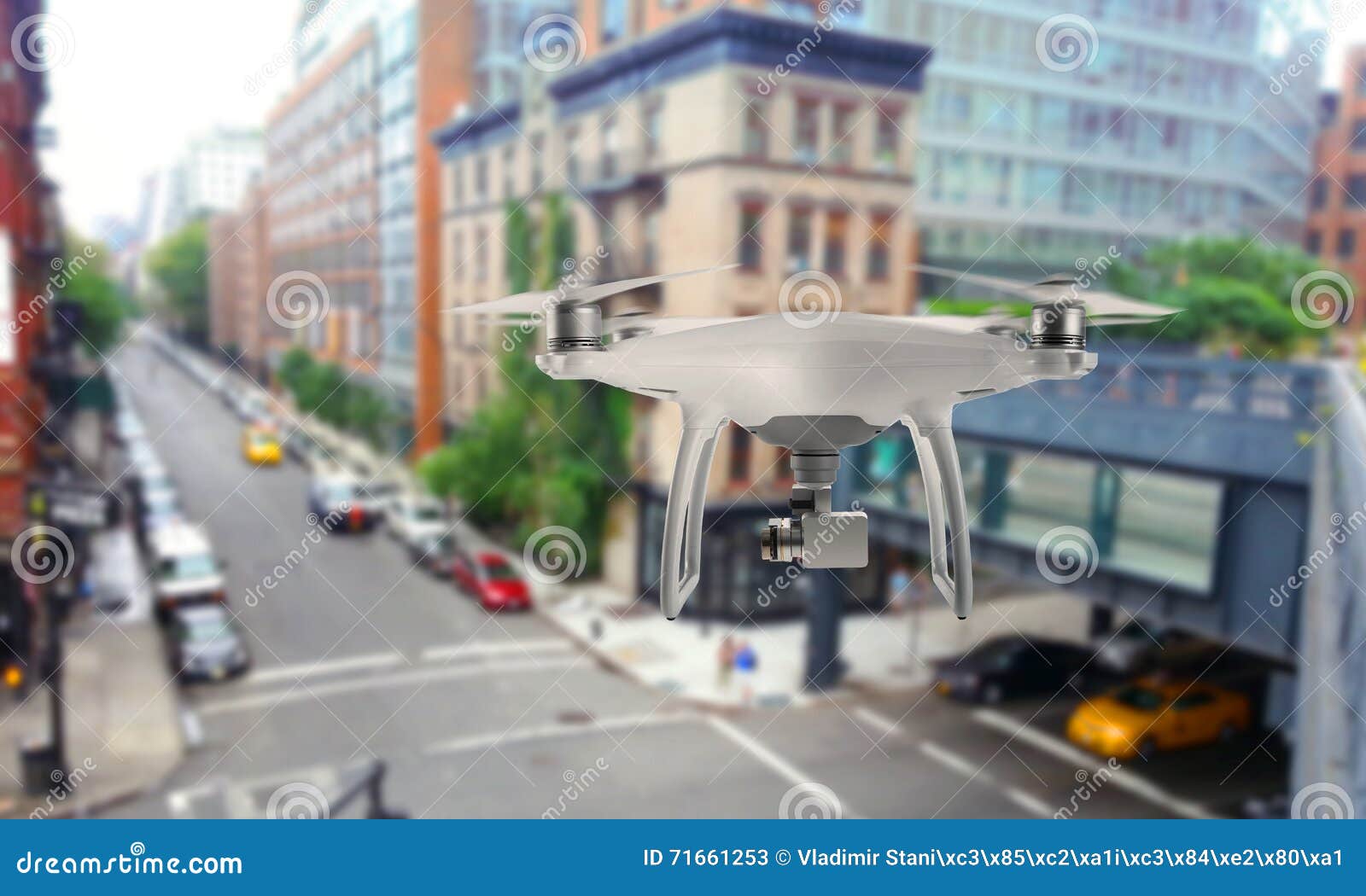 drone quad copter with camera oversees the city streets