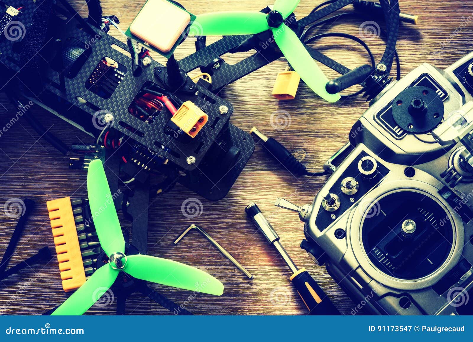 drone quadcopter with a flight controller over wooden background