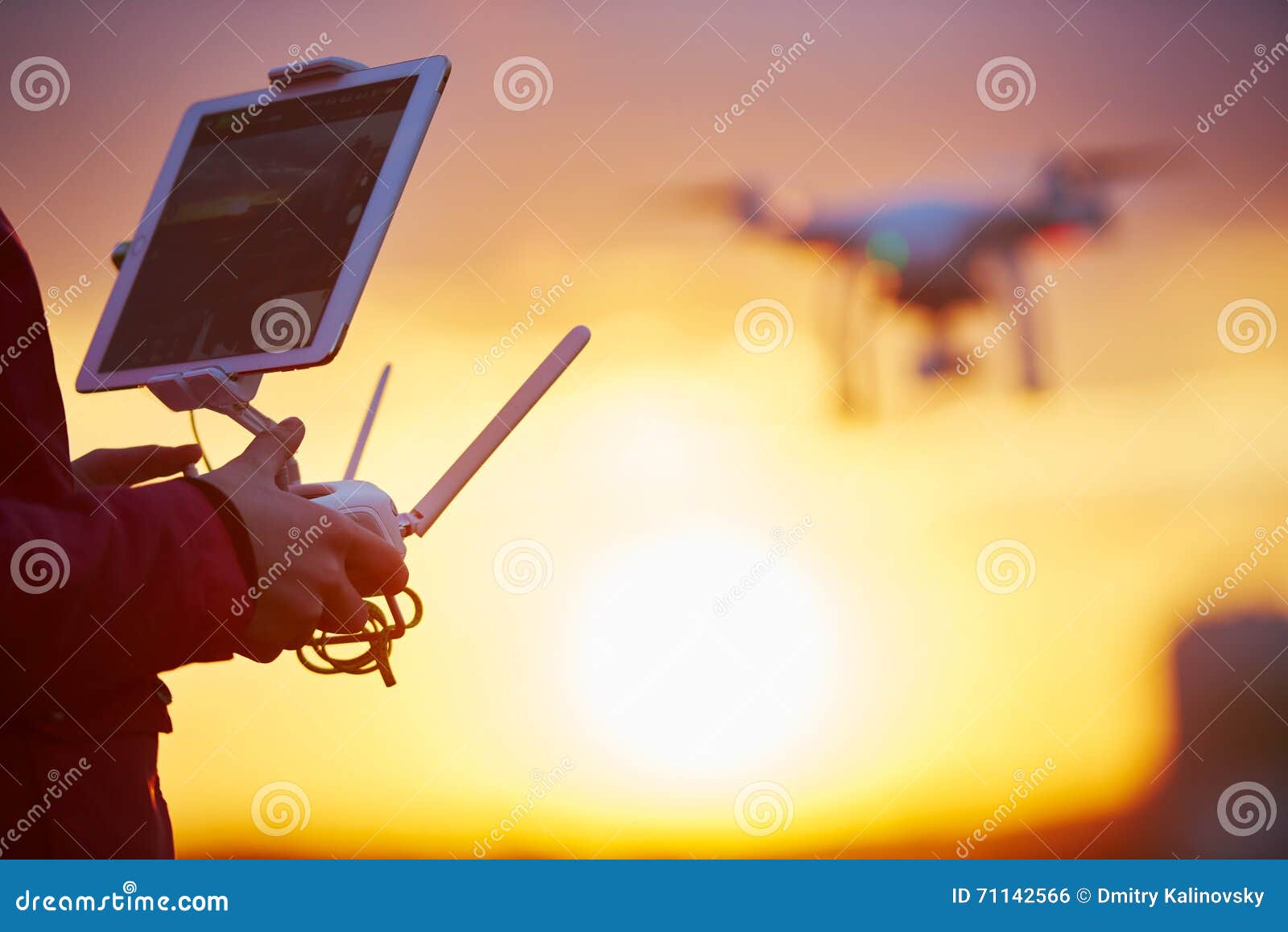 drone quadcopter flying at sunset