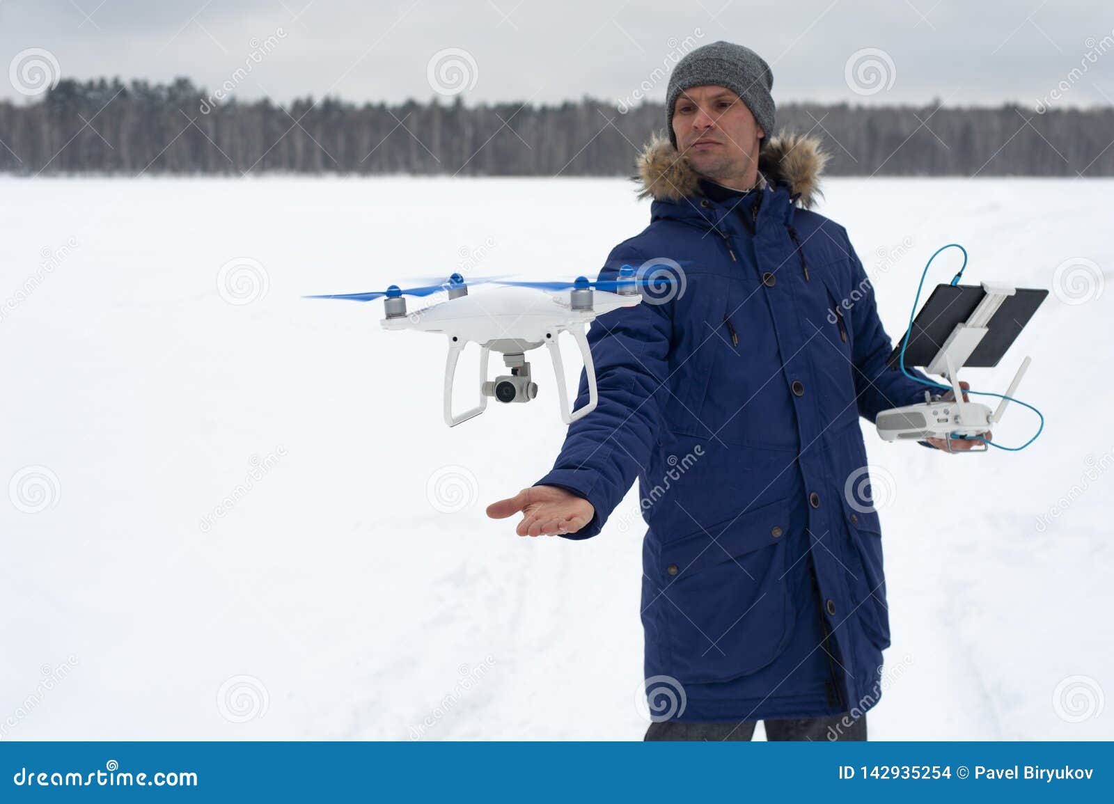Drone Videographer with Remote Control in Hands. Stock Photo Image of